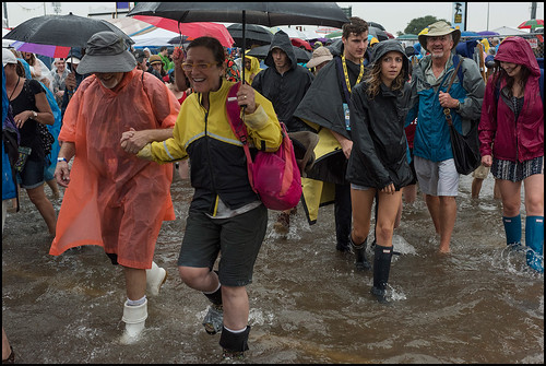 Heading home through the rain, Jazz Fest Day 6. Photo by Ryan Hodgson-Rigsbee www.rhrphoto.com