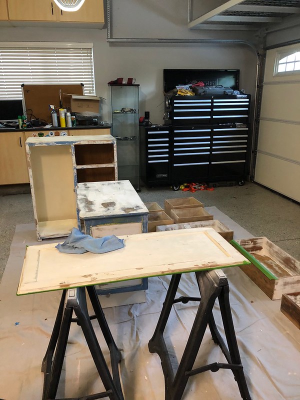 Sanding and painting the nursery furniture