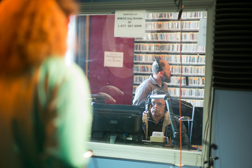 Nick Ferreirae talks to TR Johnson. Scott Borne in the background. Day 1 of Spring Membership Drive 3.18.18. Photo by Ken Maldonado.