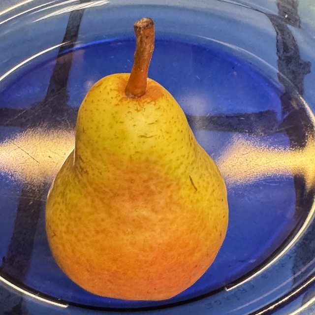 Dessert Pear On A Cobalt Blue Glass Plate